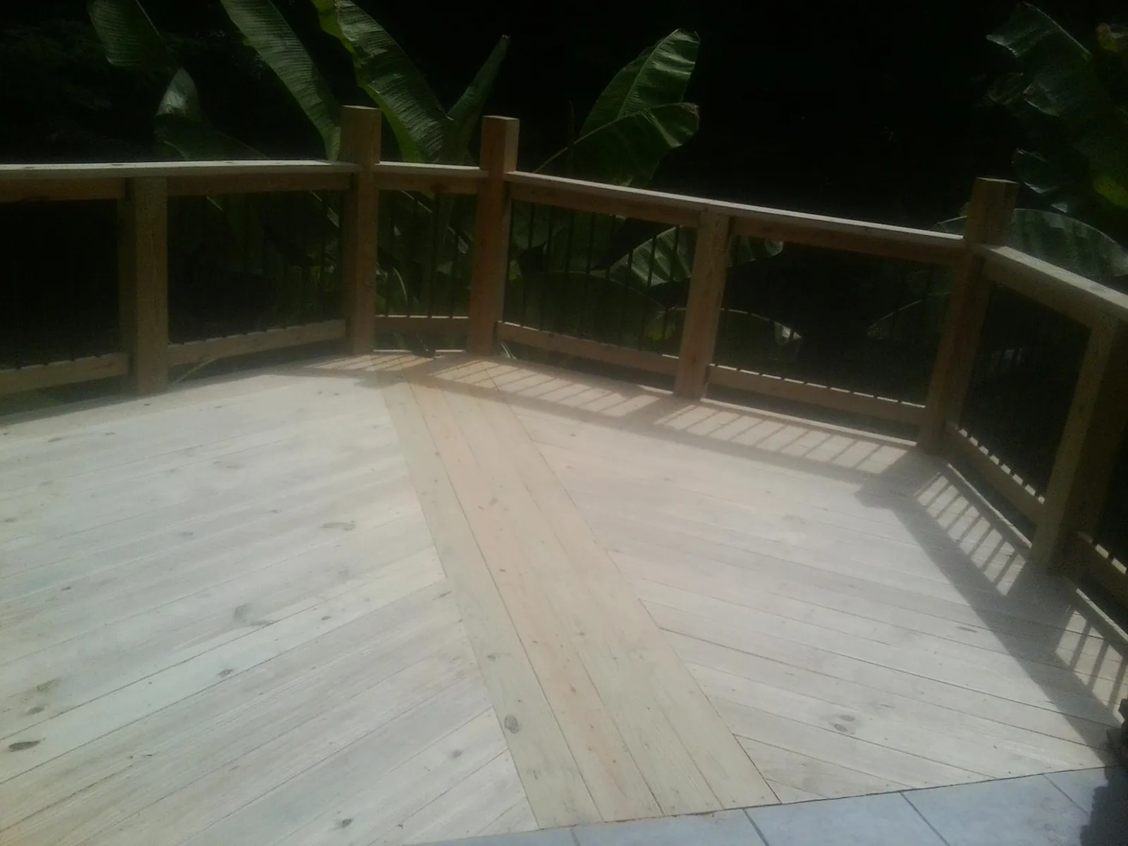 New wood deck and railing built off the back of a home in Dalton